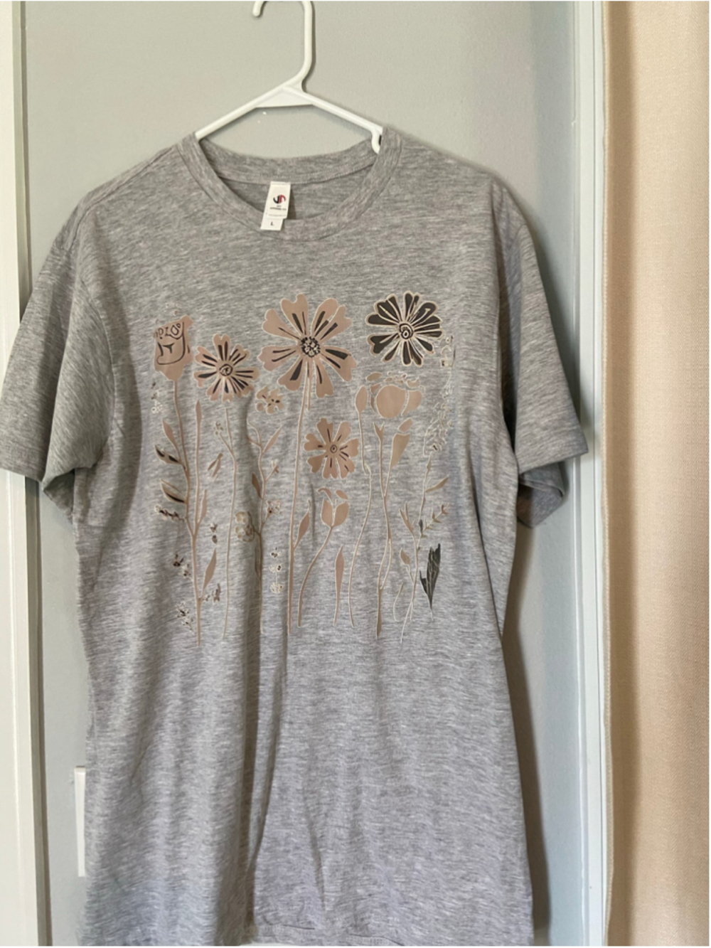 Gray floral T-shirt, JXT, size large.